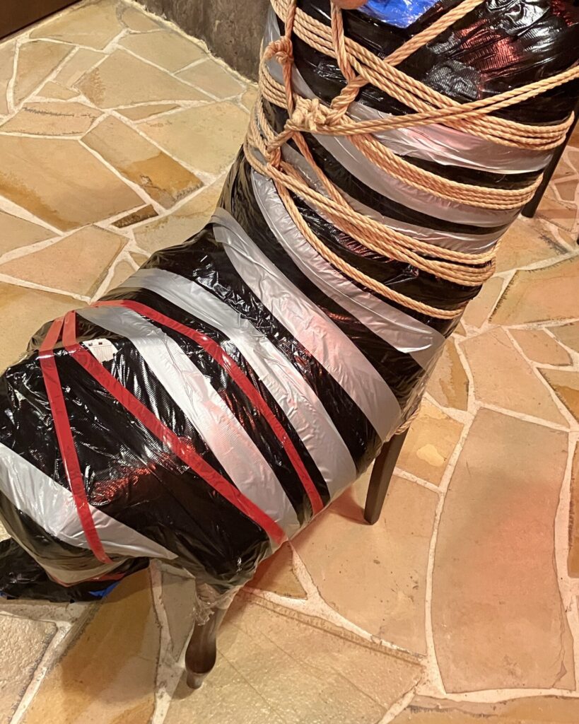Black and clear wrap with rope bondaged mummification, seated chair bondage, Tokyo dominatrix session photo