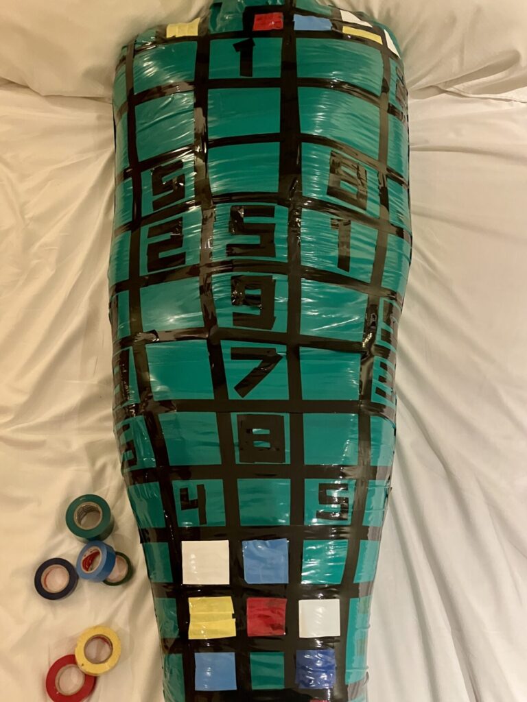 Green and black tapes SUDOKU mummification on chair, Tokyo femdom session gallery
